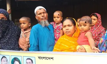 বাবা হত্যার বিচারের দাবিতে রাজপথে ৬ মাসের শিশু বায়োজিদ